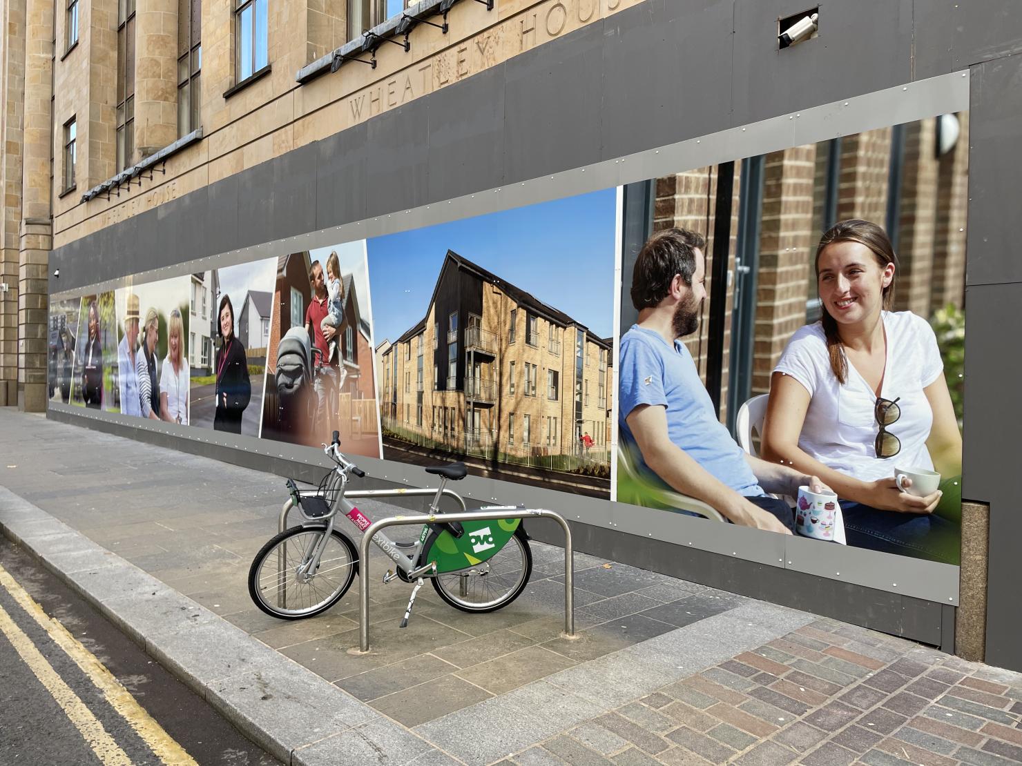 graphics outside Wheatley House depicting happy families