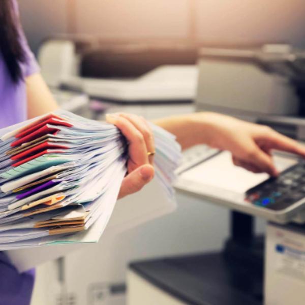 Business woman scanning paper