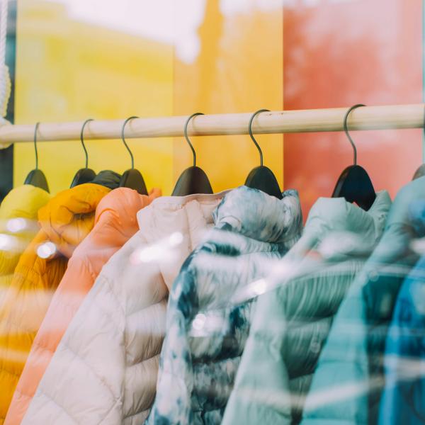 Coats on hangers in shop.