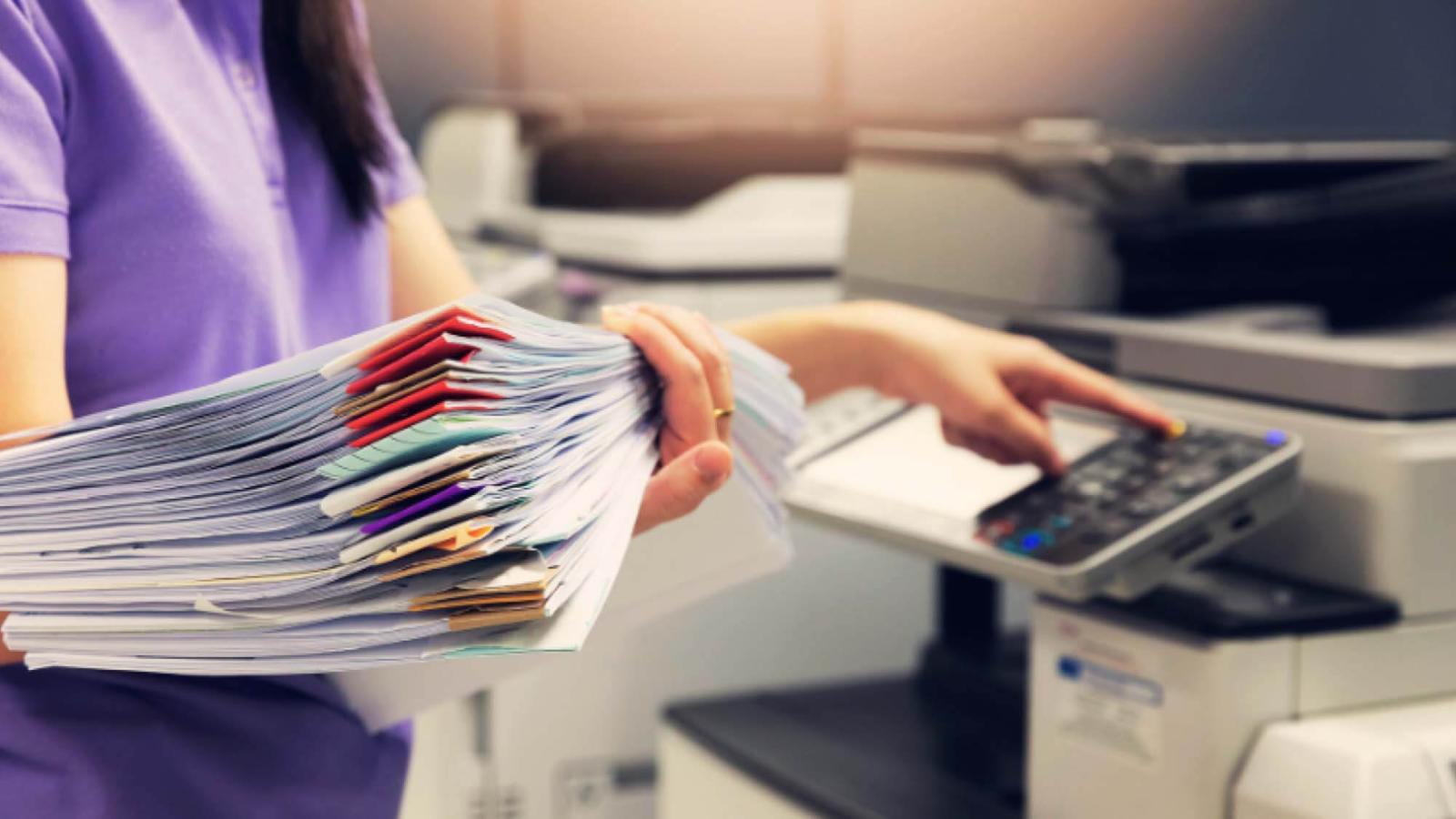 Business woman scanning paper